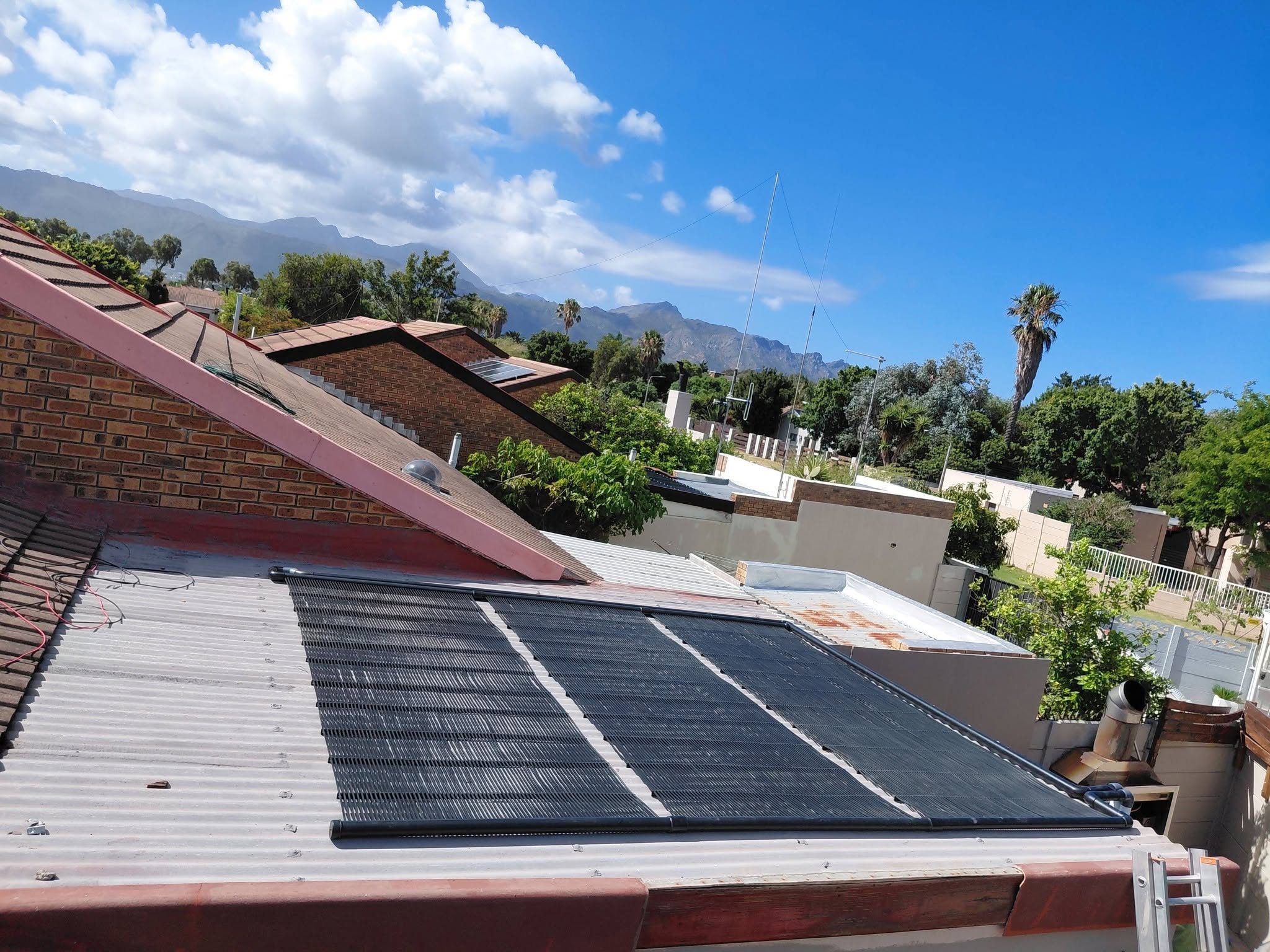 Solar pool heating above a Cape Town swimming pool