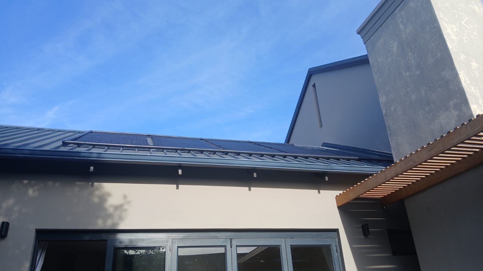 Completed solar collector array on a residential roof
