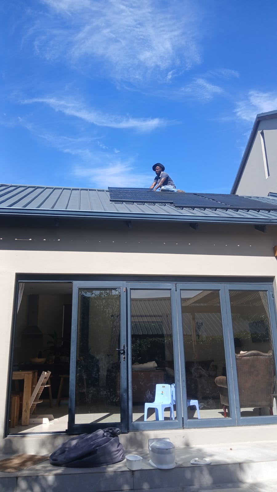 Solar collectors above a home patio